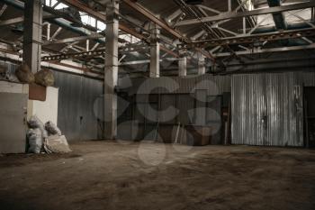 Abandoned factory corridor, grunge interior, nobody. Old broken industry building, empty industrial house