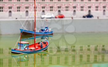 Rescue boat, rescuer and dog, miniature scene outdoor, europe. Mini figures with high detaling of objects