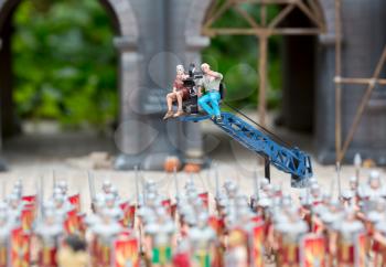 Film shooting about the army of romans, war miniature scene outdoor, europe. Mini figures with high detaling of objects, realistically diorama, toy model
