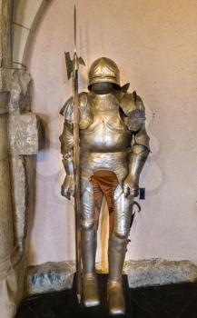 Knight's armor in old castle, ancient stone building, Europe. Traditional european architecture, famous places for tourism and travel, historical heritage