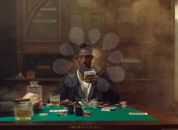 Poker player plays in casino. Games of chance addiction. Man leisures in gambling house, gaming table with green cloth