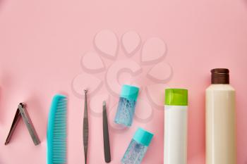 Oral care products, pink background, nobody. Morning healthcare procedures concept, toothcare, different toothbrushes and toothpaste