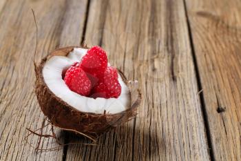 Fresh raspberries in a coconut shell