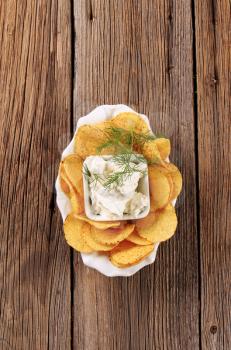 Bowl of corn chips and curd cheese