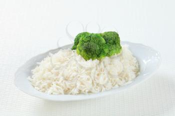 Plate of cooked white rice with broccoli