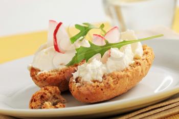 Crisp rolls with cheese spread and radish