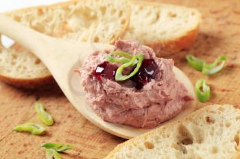 Liver pate on a wooden spoon and bread