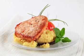 Marinated pork served with couscous 