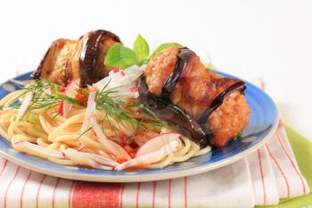 Spaghetti with meatballs wrapped in eggplant