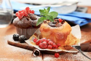 Tasty cupcakes garnished with fresh berry fruit 