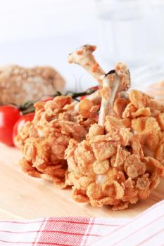 Chicken drumsticks coated with crunchy corn flakes
