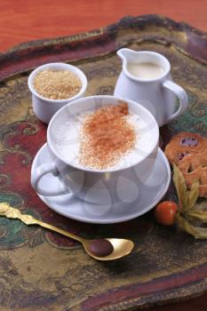 Cup of hot milk with nutmeg and  brown sugar