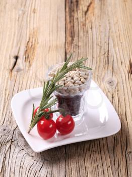 Raw beans, tomatoes and rosemary - still life