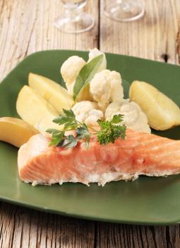 Salmon fillet served with potatoes and cauliflower 