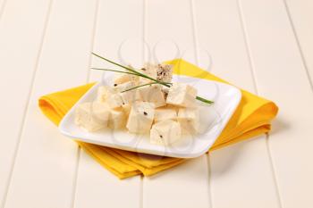 Diced feta cheese marinated in olive oil