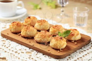 Coconut macaroons on cutting board