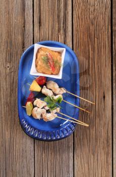 Chicken skewers and vegetable dipping sauce