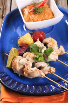 Chicken skewers and vegetable dipping sauce