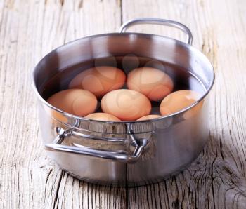 Brown eggs in a pan - closeup