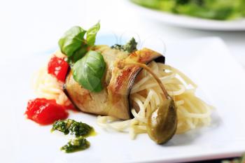 Spaghetti wrapped in a slice of grilled aubergine