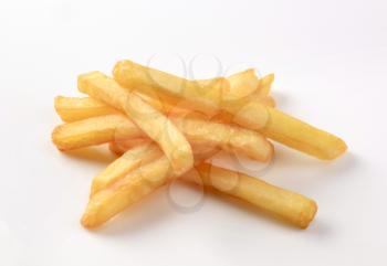 Heap of French fries on white background