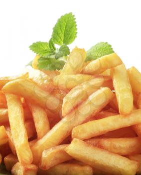 Heap of freshly fried French fries - detail