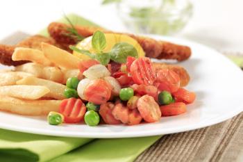 Side dish of mixed vegetables and French fries 