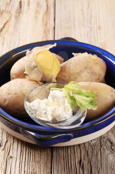 Bowl of boiled potatoes and curd cheese