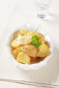 Cooked new potatoes in a porcelain bowl
