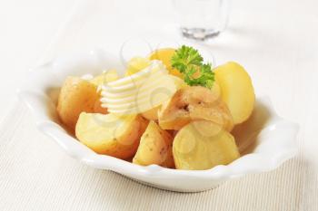 Cooked new potatoes in a porcelain bowl