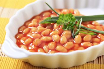 Baked beans in a porcelain casserole dish