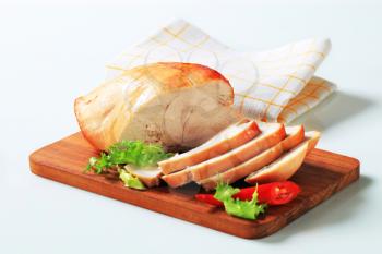 Roast turkey breast on cutting board