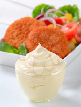 Cup of mayonnaise, fried cheese with vegetable salad 