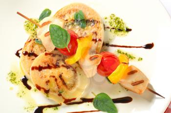 Grilled chicken skewer with sliced aubergine with pesto and balsamic vinegar