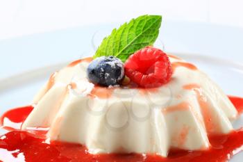 Panna cotta with fruit coulis and wild berries