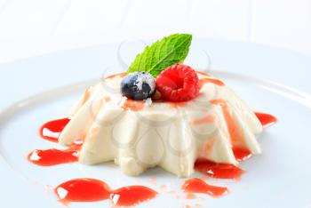 Panna cotta with fruit coulis and wild berries