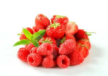 Studio shot of fresh strawberries and raspberries
