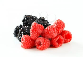 Studio shot of fresh raspberries and blackberries