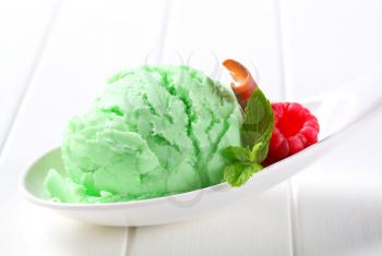 Scoop of green ice cream on a spoon