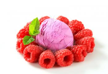 Scoop of fruit ice cream with fresh raspberries
