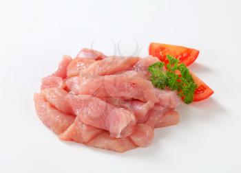Diced turkey breast on white background