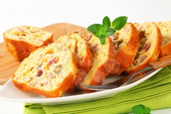 Slices of savory ham and olive cake
