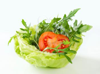 Rocket salad in a bowl made of ice lettuce