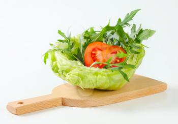 Rocket salad in a bowl made of ice lettuce