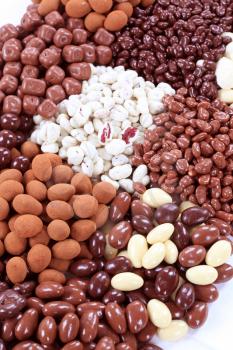 Assortment of chocolate and yogurt covered nuts and fruit 