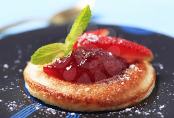 Pancake topped with strawberry jam 