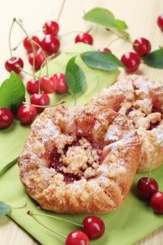 Danish pastry with fresh cherries - closeup