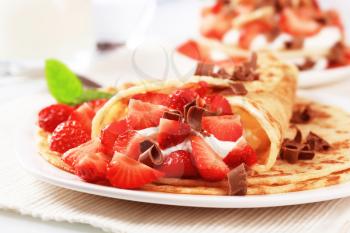 Crepes filled with sweet cream cheese and strawberries