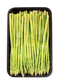 Fresh asparagus spears in plastic container