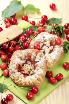 Danish pastry and fresh cherries - overhead
